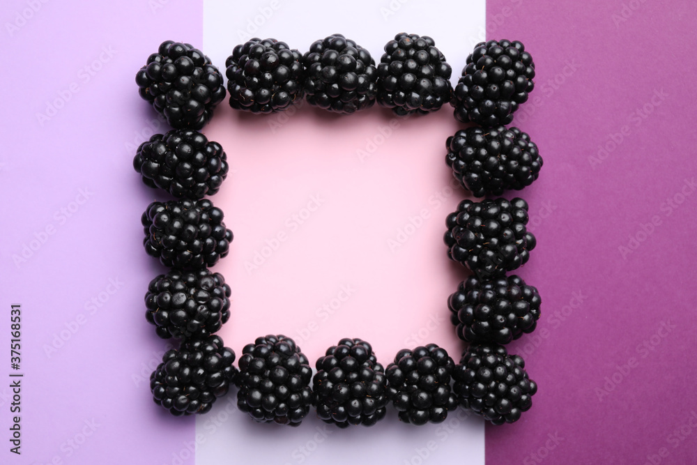 Frame of ripe blackberries on color background, flat lay. Space for text Frame of ripe blackberries on color background, flat lay. Space for text