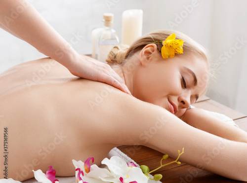 Thai body massage. Enjoying massage smiling girl