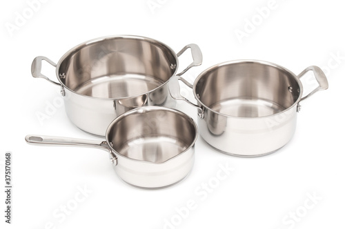 Empty stainless saucepans isolated on white background