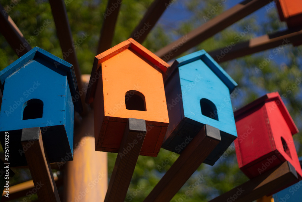 Bird houses. Colored birdhouses on the street. Bird houses. Colored birdhouses on the street.