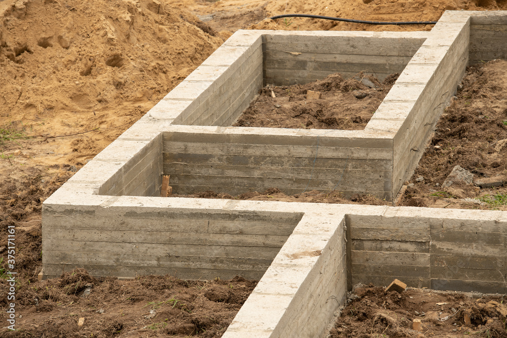 Above view of concrete wall footing for new house Above view of concrete wall footing for new house