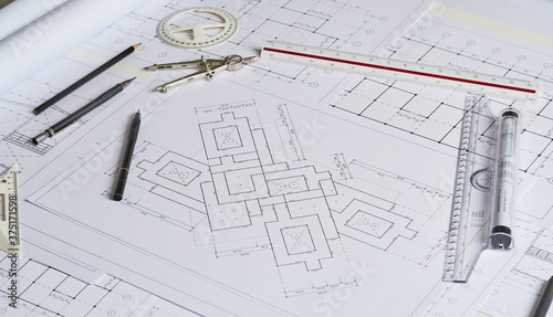 Architect engineer contractor design working drawing sketch plan blueprint and making architectural construction house building in architect studio.