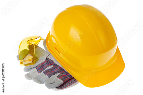 Yellow plastic hard hat glasses and protective gloves isolated on white background. Safe labor concept