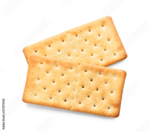 Delicious crispy crackers isolated on white, top view