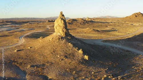 Aerial point of interest shot of a big rock formation of the Trona Pinnacles during the sunrise. photo