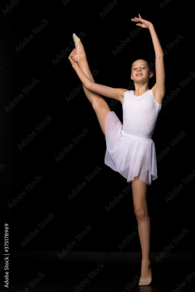 Full length portrait of a charming gymnast girl in elegant dress.