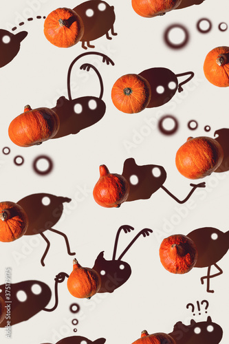 Fototapeta Naklejka Na Ścianę i Meble -  Pattern of many different pumpkins with a hard shadow on a gray background. Halloween concept.