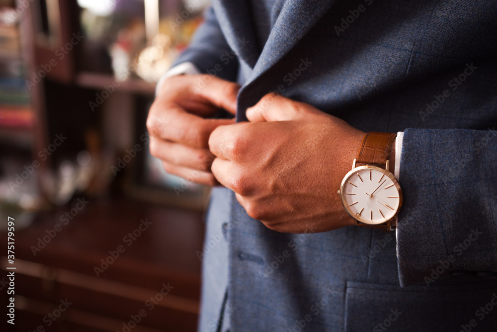 businessman in suit with a clock on his hand