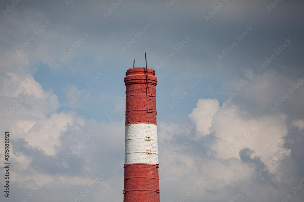 Boiler room pipe. Factory chimney against the sky Boiler room pipe. Factory chimney against the sky