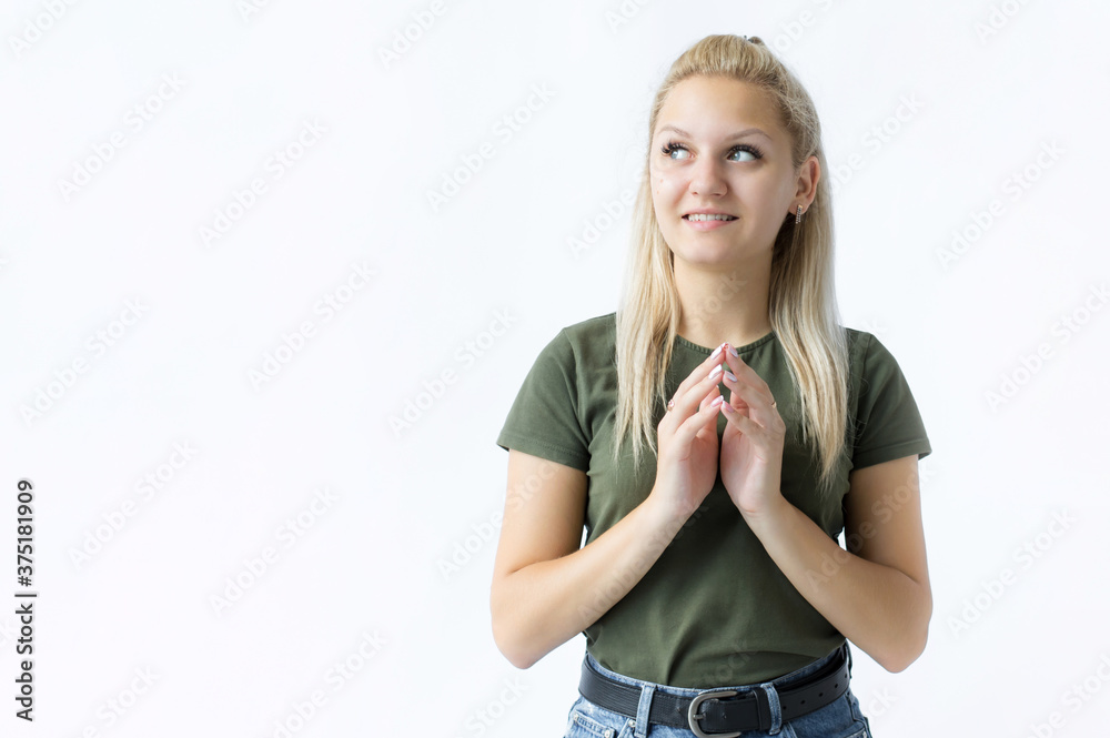 Portrait of a smiling girl, hands in front of her chest. Girl on white background Portrait of a smiling girl, hands in front of her chest. Girl on white background