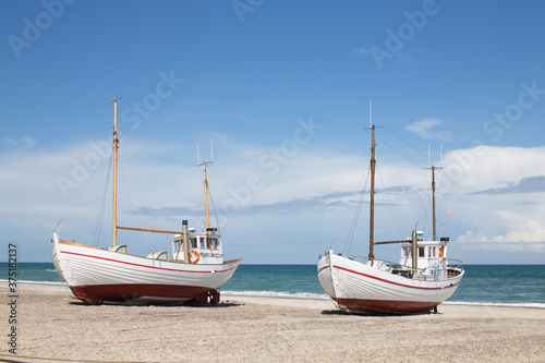 Fishing boats on the beach photo