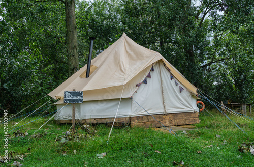 A fabric bell tent in the woods © iammattdoran