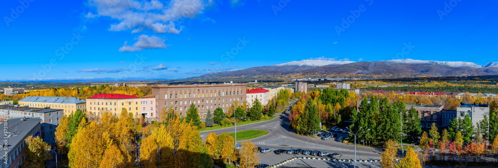 Panoramic shot of the polar city of Apatity in late autumn. The peaks of the mountains are covered with snow. 