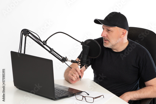 A man in front of a Studio ...