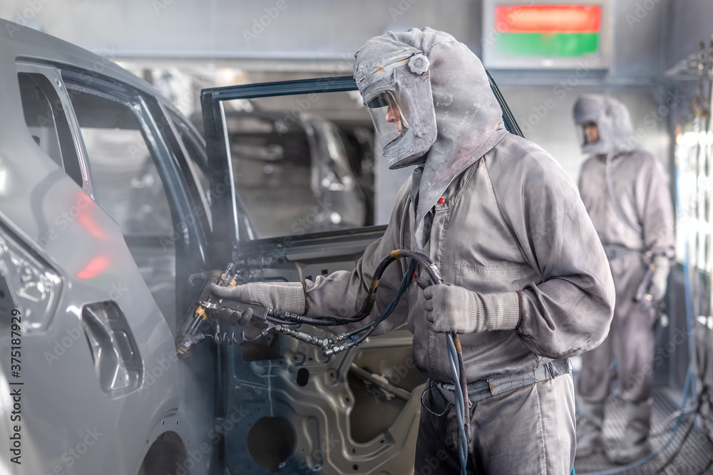employee body painting workshop carries out painting of the internal elements of the car. employee body painting workshop carries out painting of the internal elements of the car.