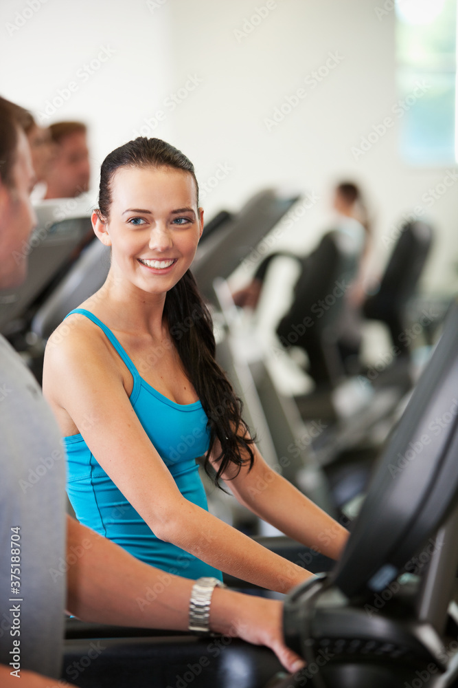 Gym: Woman Flirts with Man While on Treadmill Gym: Woman Flirts with Man While on Treadmill