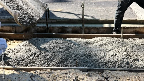 Wallpaper Mural Construction filling formwork with cement and gravel worker pour cement for sidewalk in concrete works Torontodigital.ca