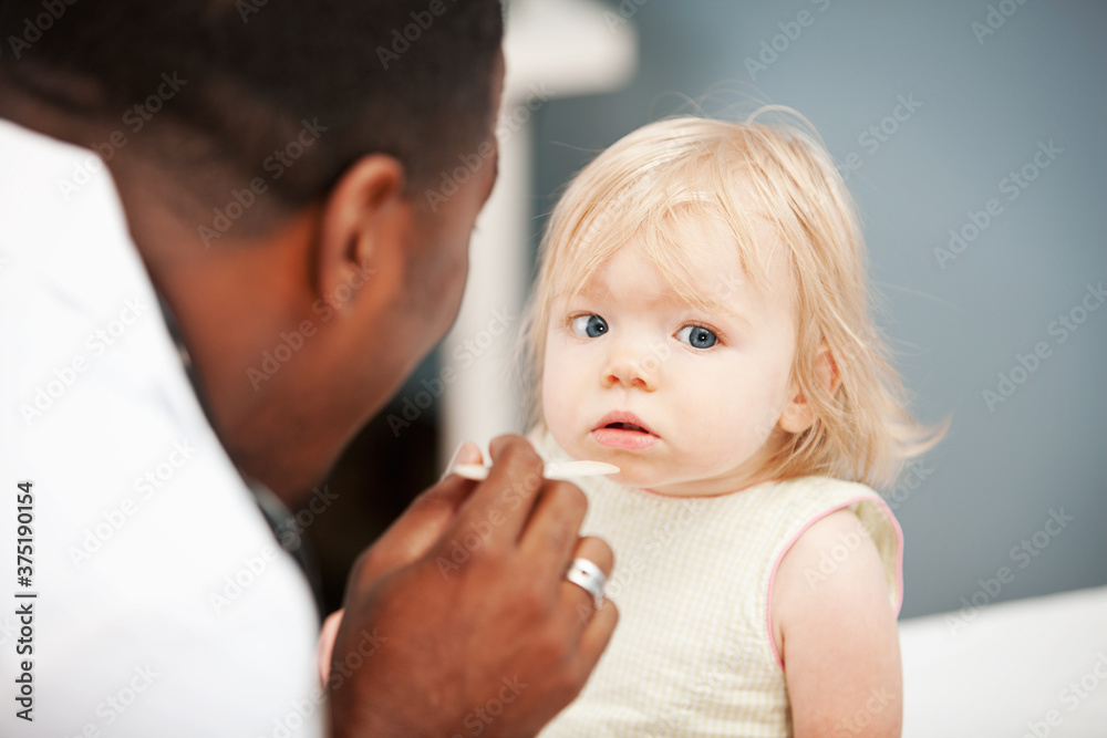 Pediatrician: Child Patient Unsure of Tongue Depressor Pediatrician: Child Patient Unsure of Tongue Depressor