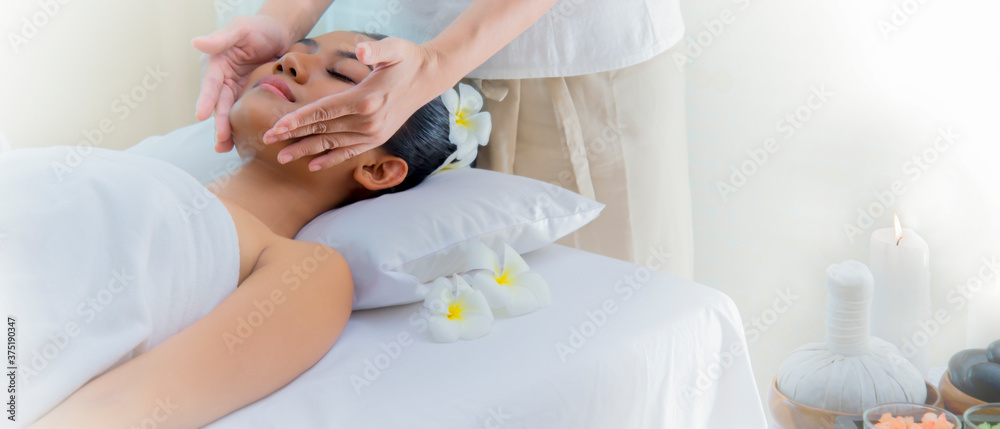 Portrait of asian woman laying down relax  with massage in spa salon