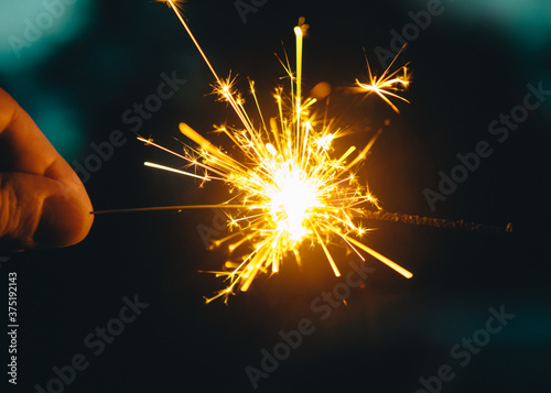 Fingers Holding a Sparkler