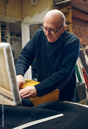 Craftsman working with his hands photo