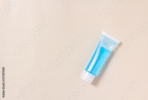 Flat lay blue alcohol gel tubes for prevention and disinfection of corona virus. Or hand wash in hospital or home for safety. Isolated style gray background and copy space for text.