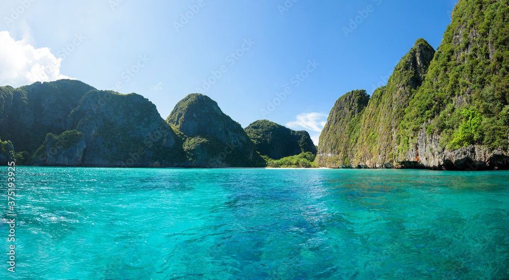 Beautiful view landscape of tropical beach , emerald sea and white sand against blue sky, Maya bay in phi phi island , Thailand