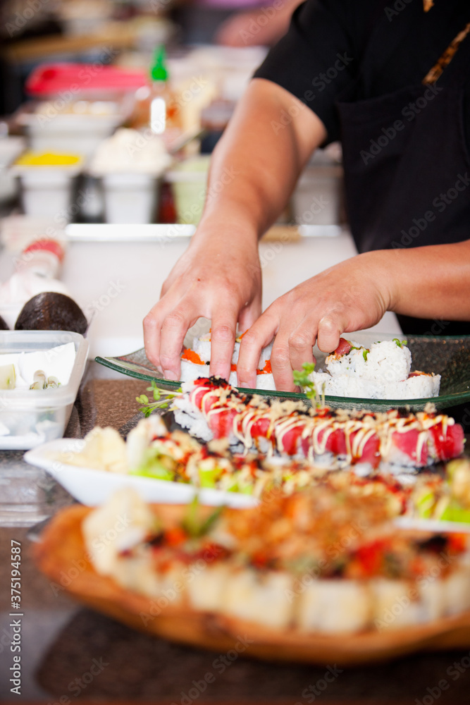 Sushi: Focus on Hands Preparing Sushi Rolls Sushi: Focus on Hands Preparing Sushi Rolls
