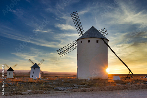 sunset of old spanish windmills on a sunny day with cloudswindmills on a sunny day with clouds