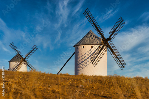 Old spanish windmills on a sunny day with clouds, Campo de Criptana, Spain