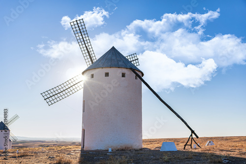 Old spanish windmills on a sunny day with clouds, Campo de Criptana, Spain