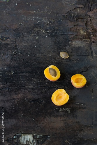 Apricots on weathered wood photo