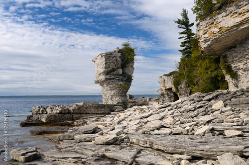 Dolomite on top of softer limestone in seastacks on shore of Flowerpot Island Canada