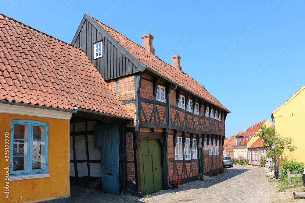 Historic half-timbered house at cobblestone street in Ribe, Denmark
