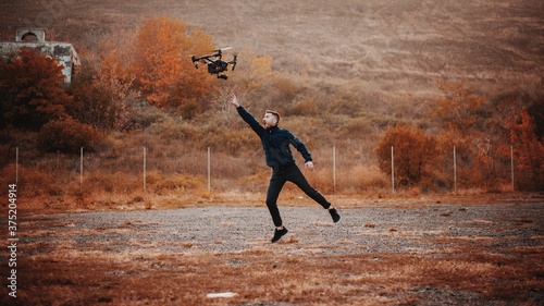 Crazy man try to catch a drone