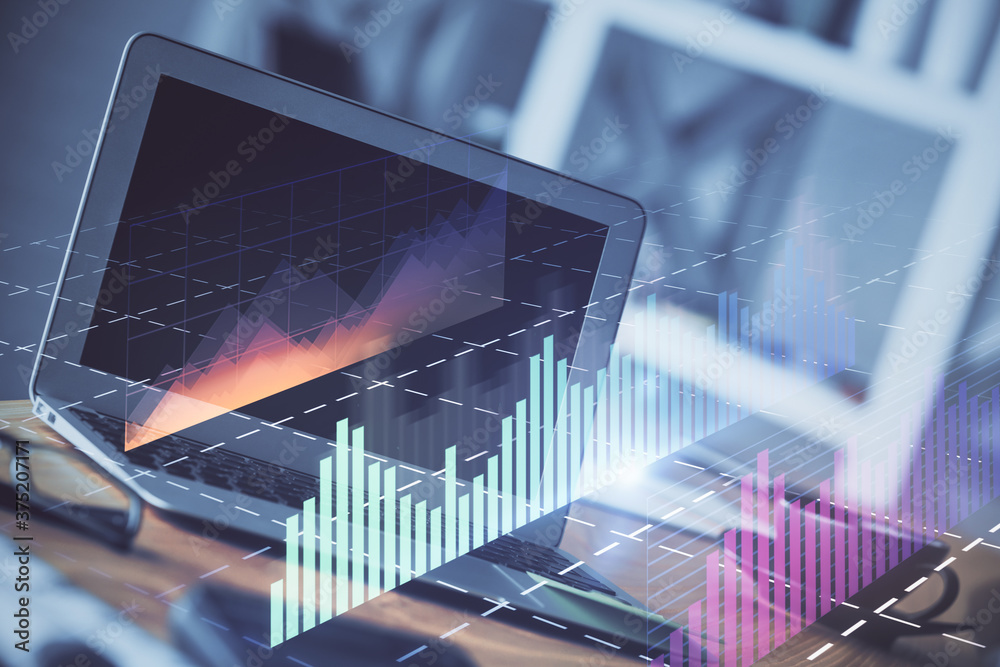 Stock market graph and table with computer background. Double exposure. Concept of financial analysis.