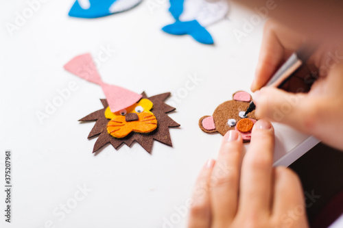 A sample of how to make the crafts at home. Multiple performing felt figures.