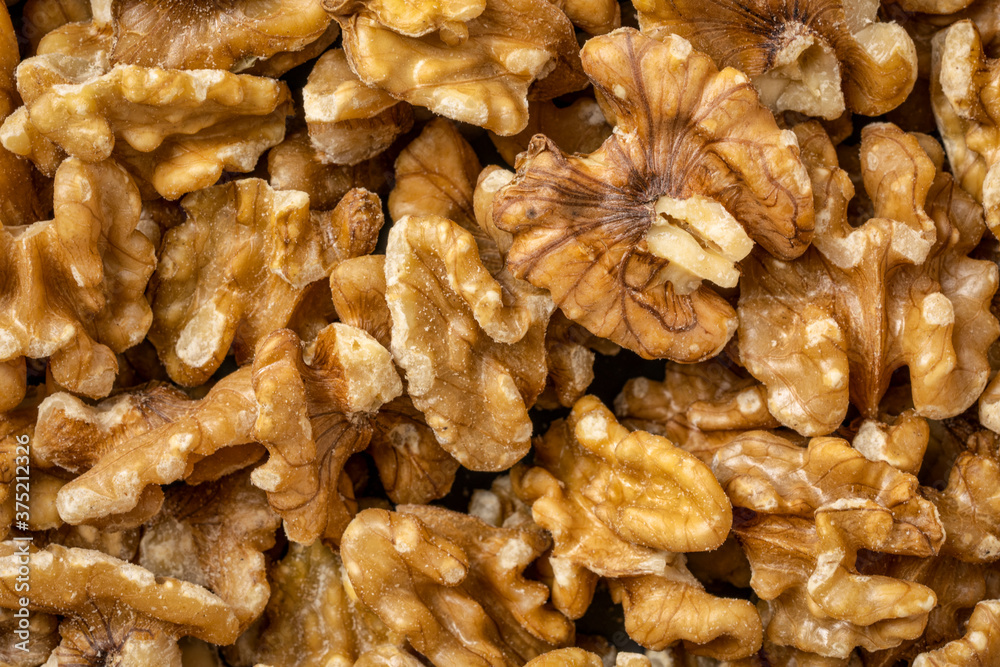 shelled English walnuts background - superfood concept shelled English walnuts background - superfood concept