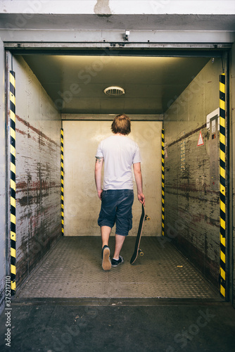 Skater in industrial elevator photo