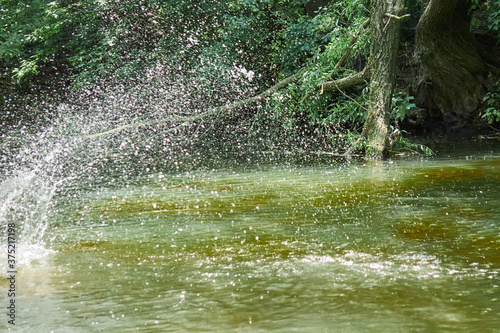 splashing on the river in the village