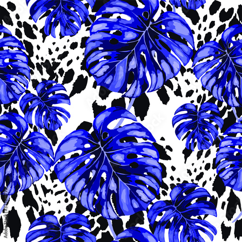 Tropical seamless pattern on animalistic texture. Jungle exotic summer print. Summer tropical leaf. Tropical flower fashion pattern. Floral tropic illustration. Vector seamless pattern.