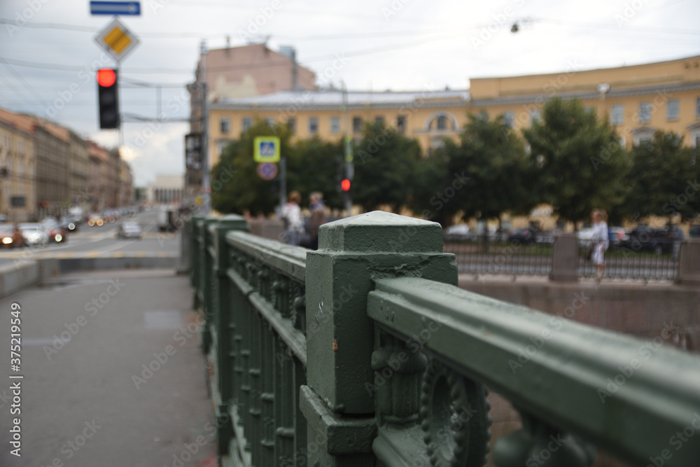 Old cast iron fence on a bridge in a big city