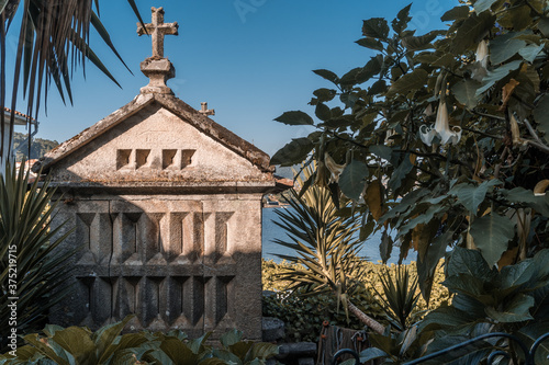 The old town of Combarro has the largest collection of horreos (typical granaries) and Cruceiros (traditional Calvary sculptures) in Galicia, the town is near Sanxenxo, Pontevedra, Spain. photo