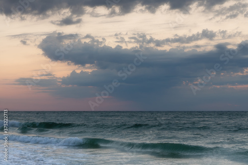 Beautiful seascape. Dawn at stormy sea. Image
