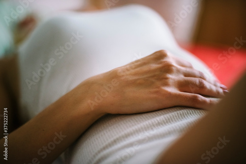 Hand holding belly