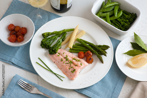 steamed salmon fillet with fresh vegetables photo