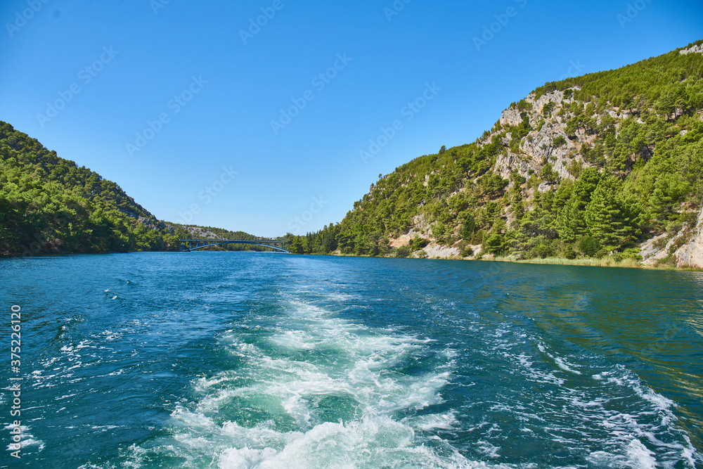 White water behind a boat during the trip to Krka waterfalls
