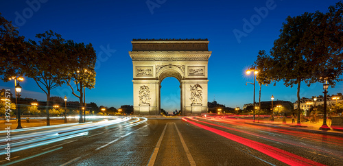 Famous Arc de Triomphe at night photo