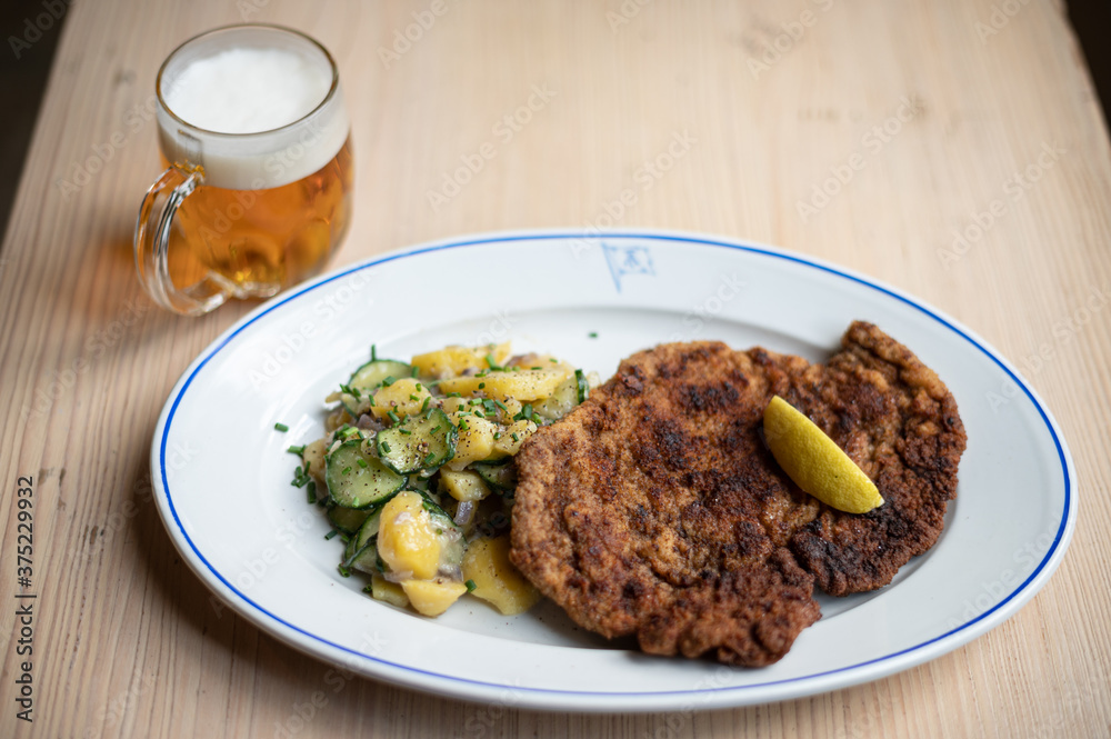 Schnitzel with potato salad and beer Schnitzel with potato salad and beer