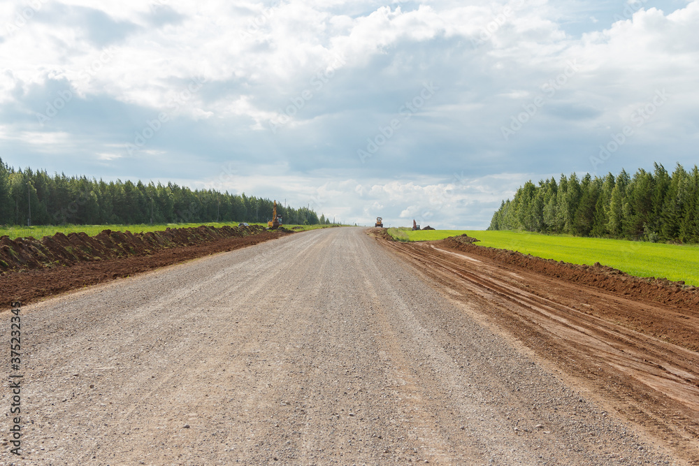 The road in the countryside between the forests. Rural Road The road in the countryside between the forests. Rural Road